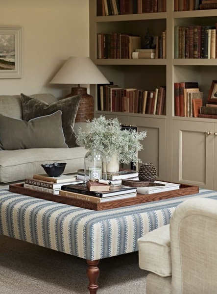 upholstered ottoman, striped ottoman, living room ottoman, fabric ottoman, coffee table ottoman, brand awareness, lifestyle, calm, luxurious, neutral, blue